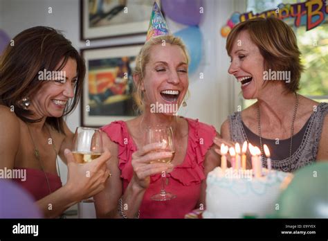 Woman laughing at birthday party