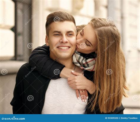 Image of a happy couple cuddling
