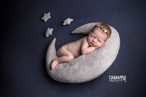 Thematic image of a newborn baby and moon cycles