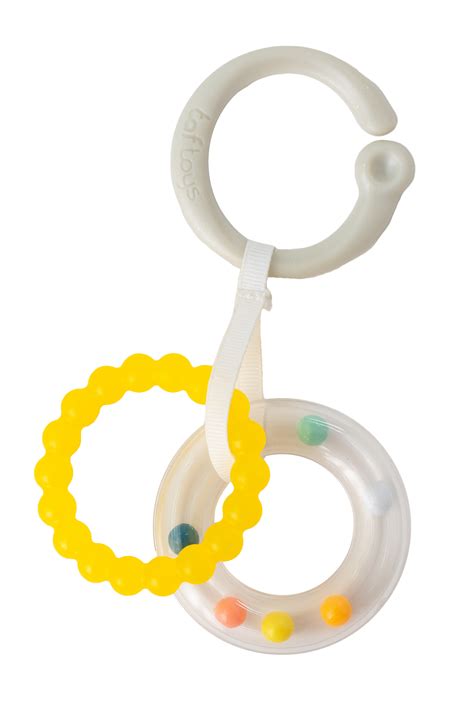 Dieťa na brušku skúma hračku