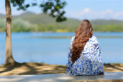 Woman contemplating image