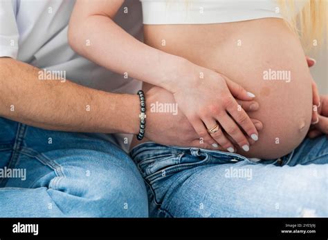 Couple in intimate embrace during pregnancy