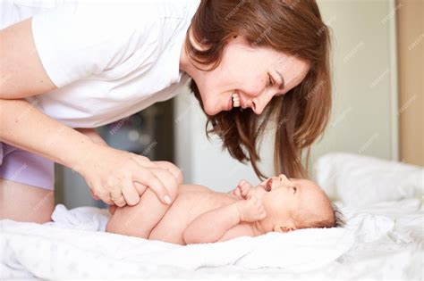 Mother massaging baby