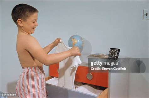 Boy selecting t-shirt