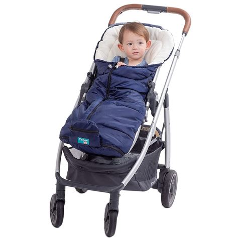 Child sleeping comfortably in a stroller with a multifunctional footmuff