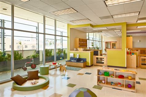 Children playing in a bright, modern daycare center