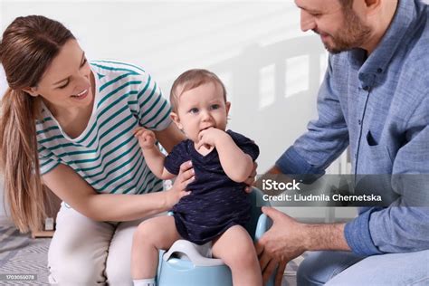 Parents and child on potty