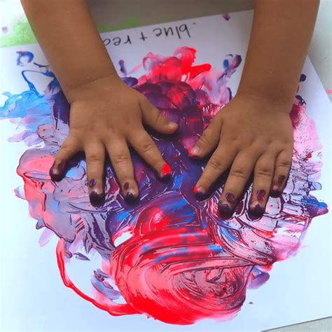 Children engaged in a vibrant finger painting activity
