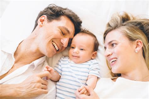 Happy family with newborn baby at home