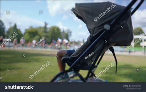 Zopa Mikra stroller in a park setting with a child inside
