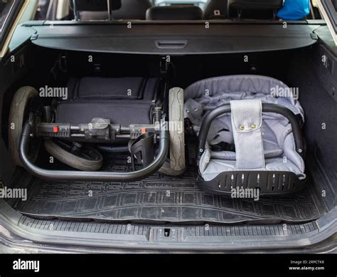 Thematic image: A modern, sleek stroller folded next to a car trunk to demonstrate compactness.