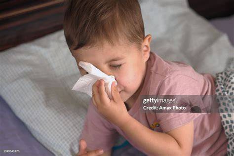 Child with runny nose and fever