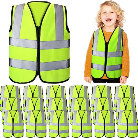 Children playing outdoors with an adult, all wearing reflective vests
