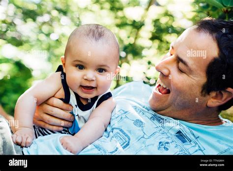 Father playing with a laughing baby