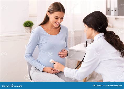 Doctor examining a pregnant woman