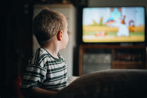 Child watching TV with bad words on screen