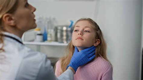 Doctor examining a child's throat