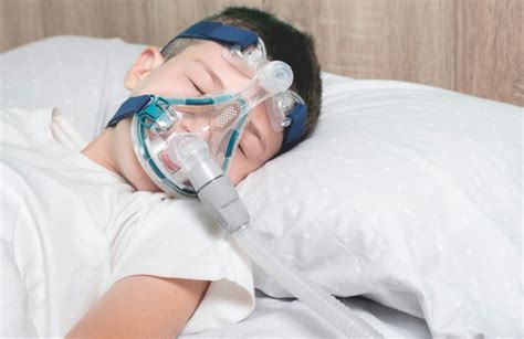 Child sleeping with CPAP mask