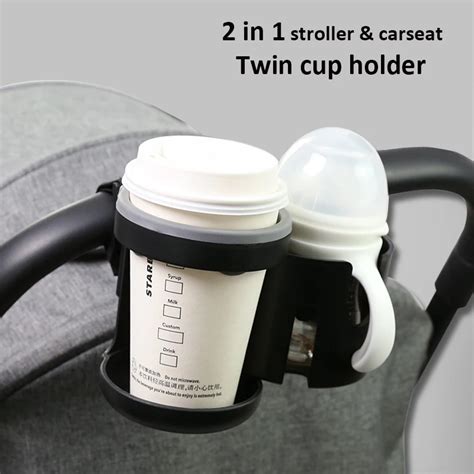 Various drinks in a cup holder on a stroller