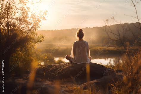 Person meditating in nature