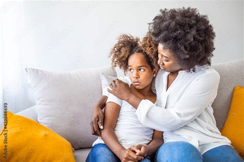 Single mother and child in a comforting embrace